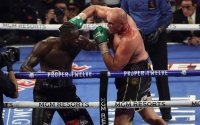 Deontay Wilder reveals he has proof that Tyson Fury cheated in two of their fights defamation of character rematch long count 15 seconds referee paffen sport gloves loose jack reiss white supremacy